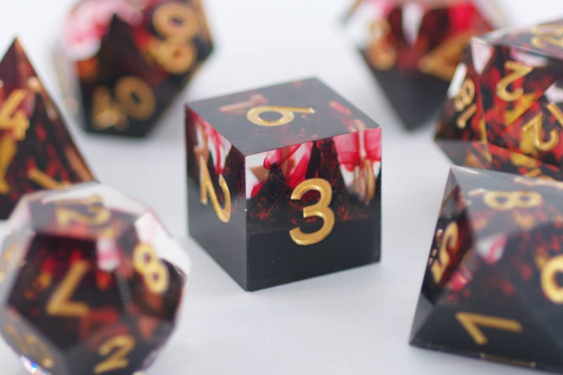 Fire Mountain Sharp Edge Black and Red Dice - Roll With Advantage