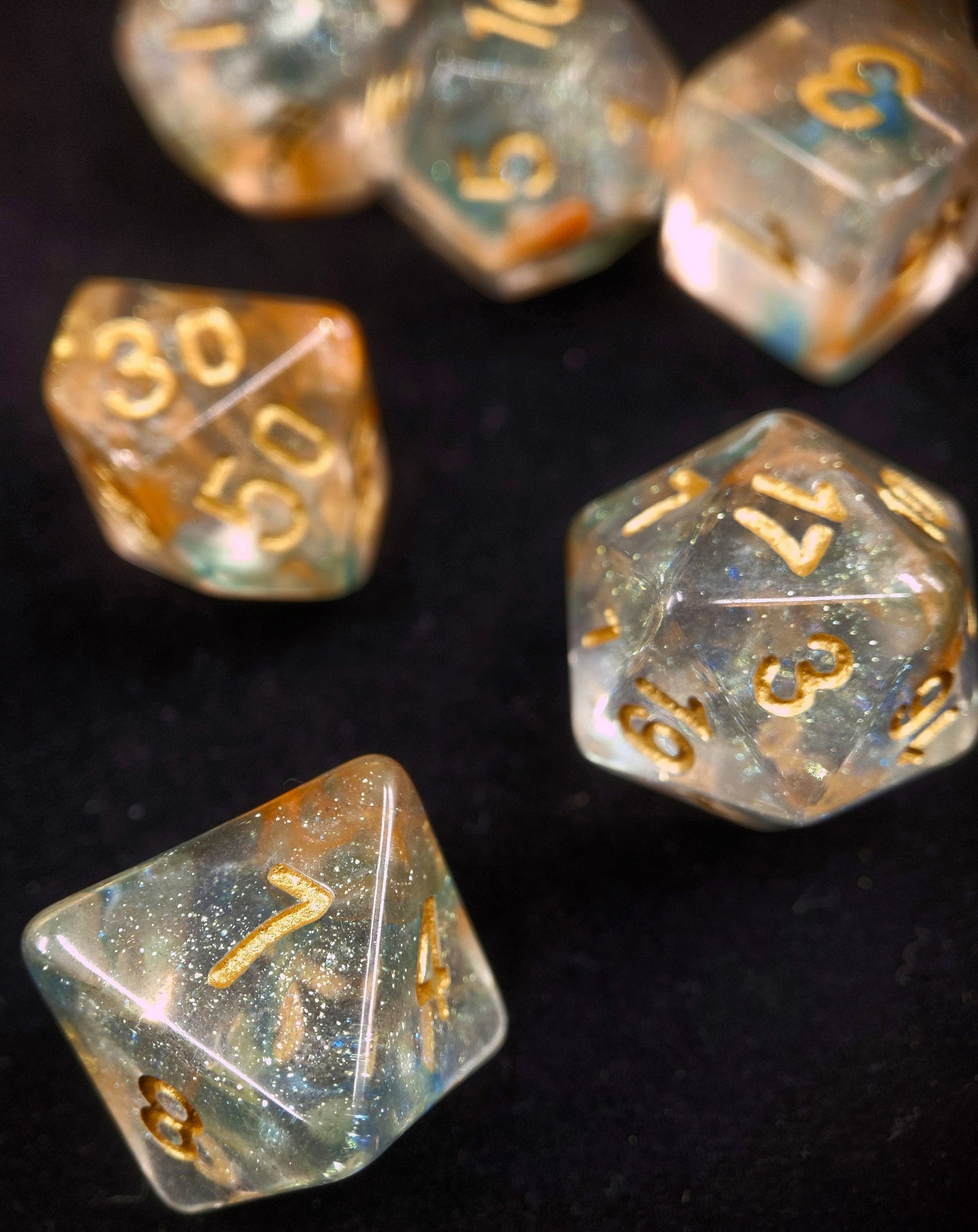 Luminous Koi Polyhedral Dice Set - Clear with Blue and Orange Swirls and micro glitter