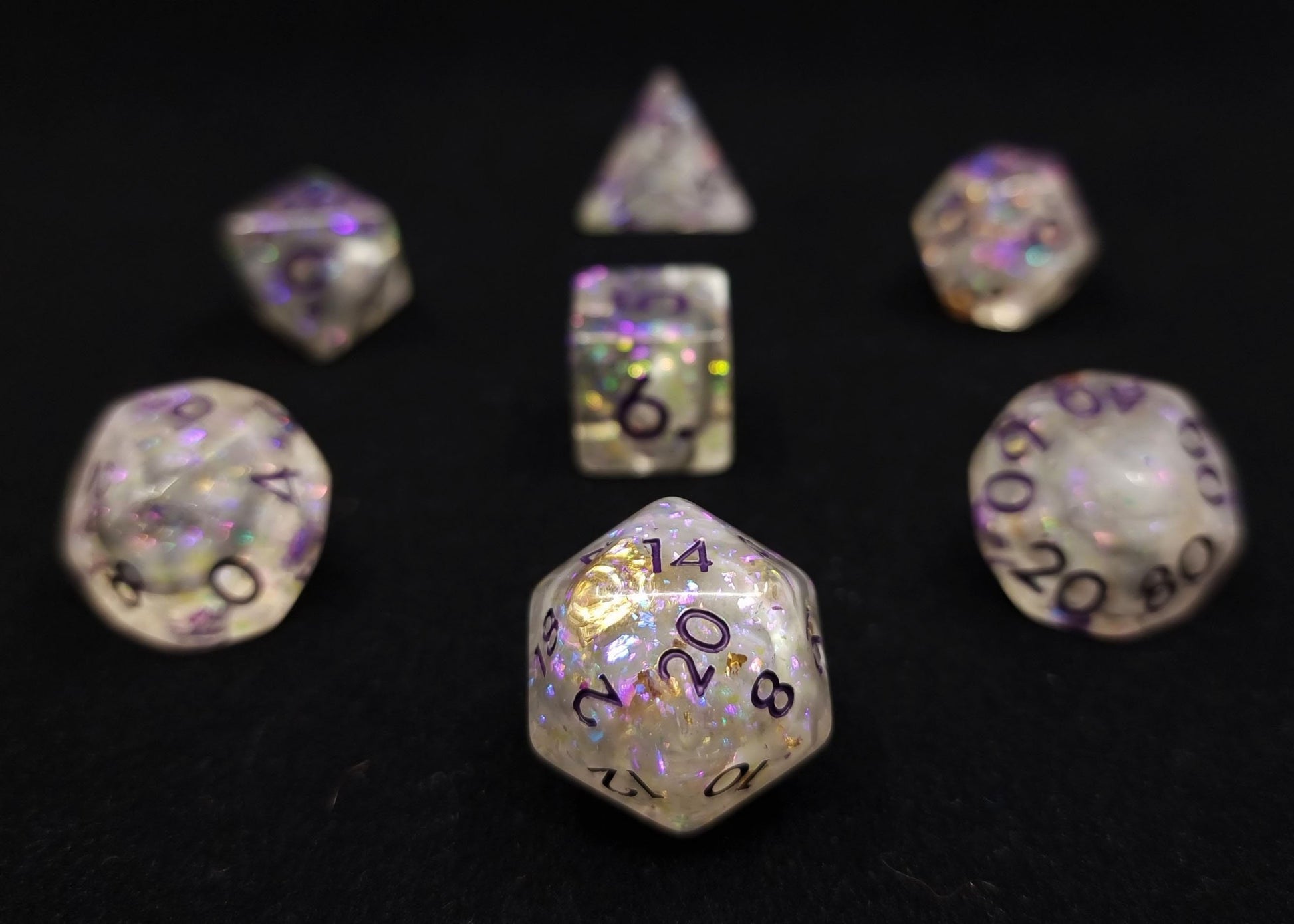 Prestidigitation Polyhedral Dice Set - Clear with White and Black Swirl, Gold Foil and Glitter with Purple Numbers
